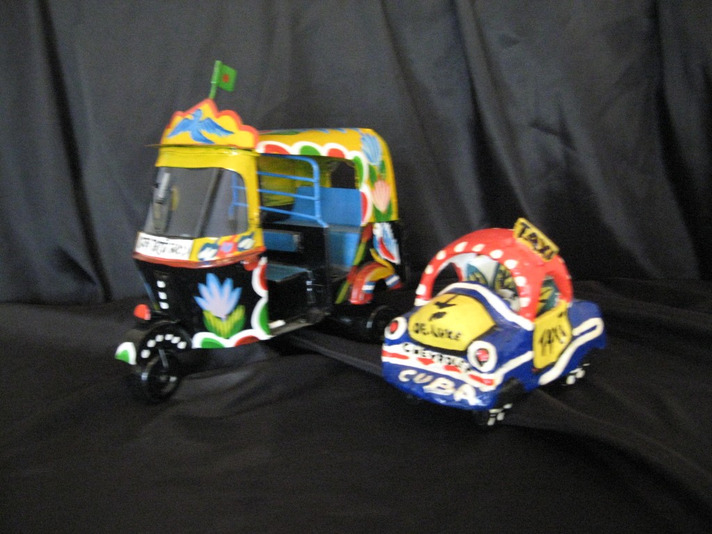 two taxis, one painted tin, India contemporary.